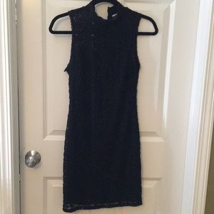 Black lace above knee dress.